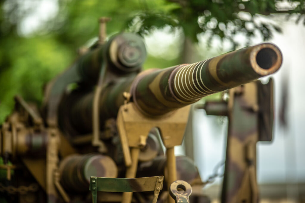 Camouflaged barrel and kill rings of a historic WWII German 88mm FlaK artillery gun at Terra Bellum