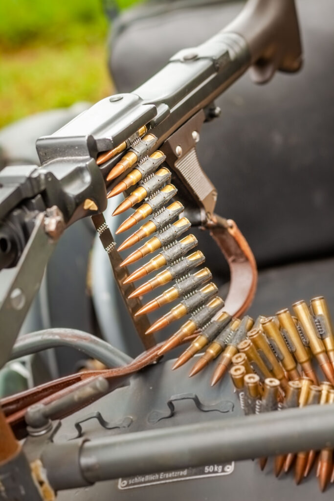 Linked machine gun ammunition belt loaded on a historic firearm for a private shooting experience at Terra Bellum
